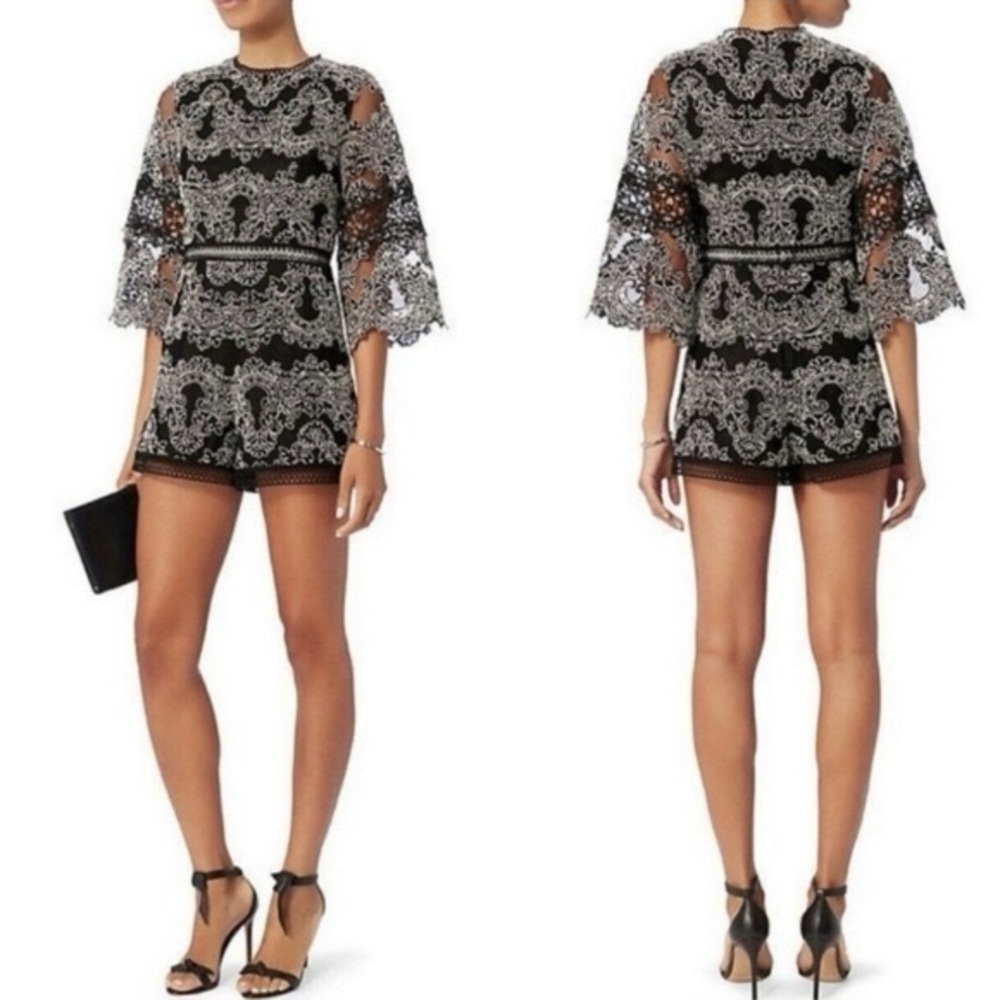 Alexis Veneda lace romper in a black and white